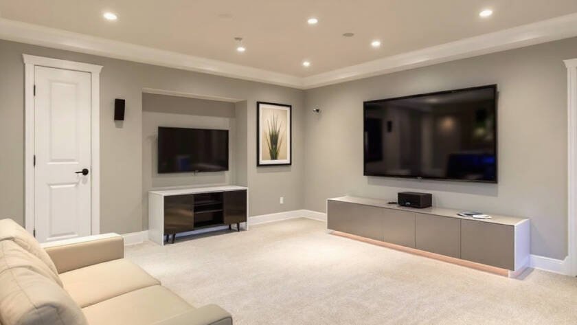 Image displaying the transformation of a Boston basement to a modern, contemporary piece of art after its renovation.